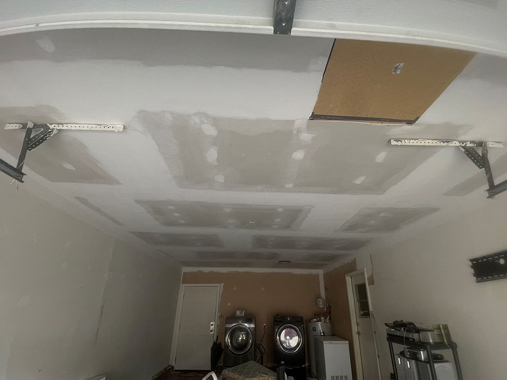 Overhead garage ceiling drywall replacement and finishing in Jack Britt Fayetteville NC